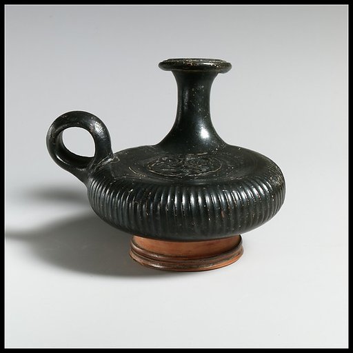 Terracotta guttus (flask with handle and vertical spout)