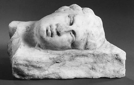 Fragment of a marble relief with the head of a girl