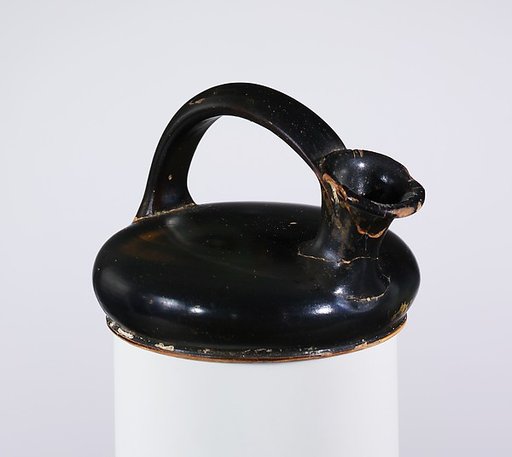 Terracotta askos (flask with a spout and handle over the top)