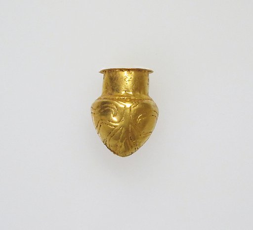 Rattle in the form of a vessel