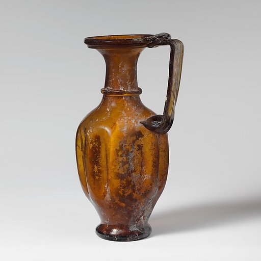 Glass jug with indented body