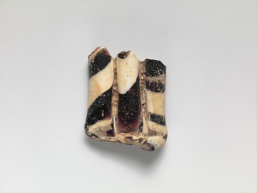 Glass mosaic handle fragment