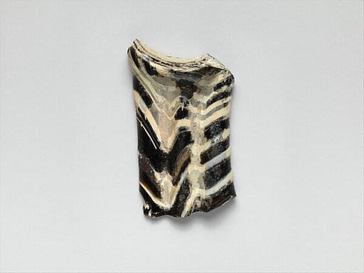 Glass mosaic handle fragment
