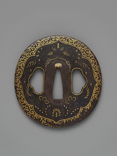 Sword Guard (<i>Tsuba</i>) Depicting Biting Lion Heads (<i>Shikami</i>) and Arabesques (獅噛唐草図南蛮鐔)