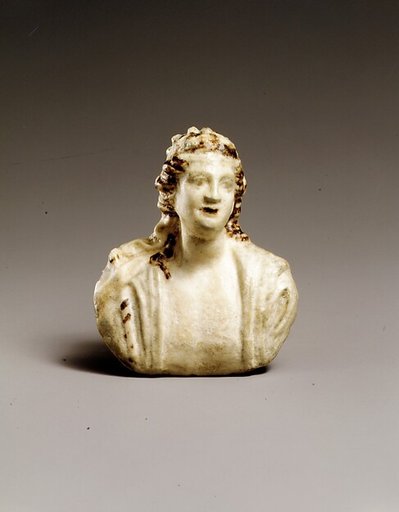 Faience appliqué with a bust of Dionysos