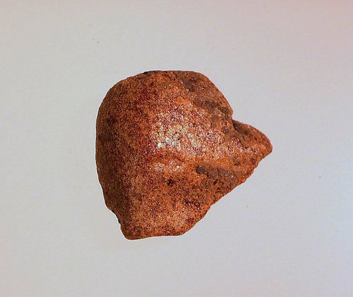 Pendant: head of a woman