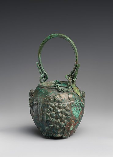 Bronze balsamarium decorated with lion-skins and herms