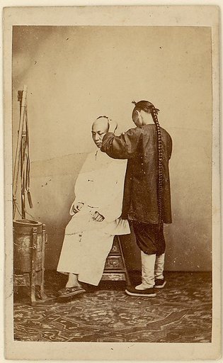 [Man Examining Other Man]