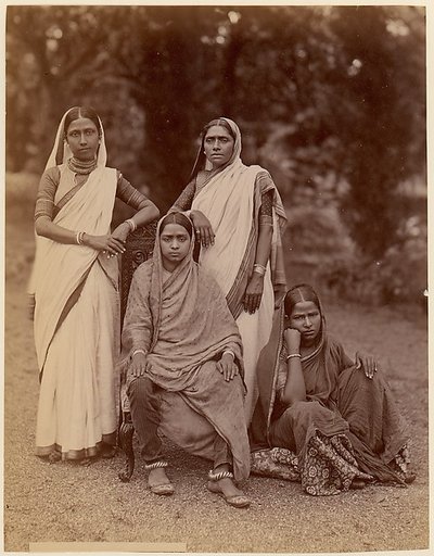 [Four Hindu Women, One Seated in a Chair, Outdoors]