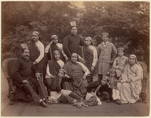 [Formal Family Portrait of Thirteen People, Men in European Dress]
