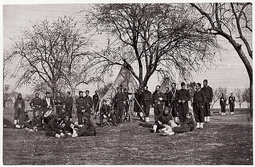 [Zouave Unit of 164th New York Infantry Beneath Trees in Tented Camp]