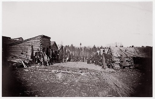 [Winter Quarters of Unidentified Union Army Regiment with Two Rows of Log Cabins]