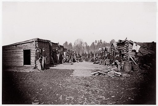 [Winter Quarters, troops with row of cabins].  Brady album, p. 128
