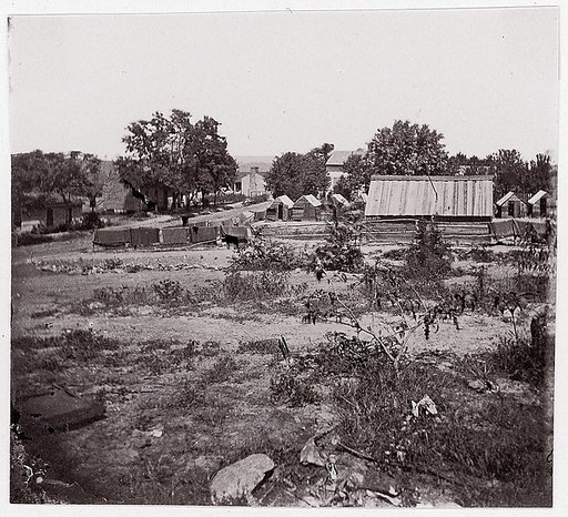 [View of a small town with wooden sheds in distance].  Brady album, p. 123