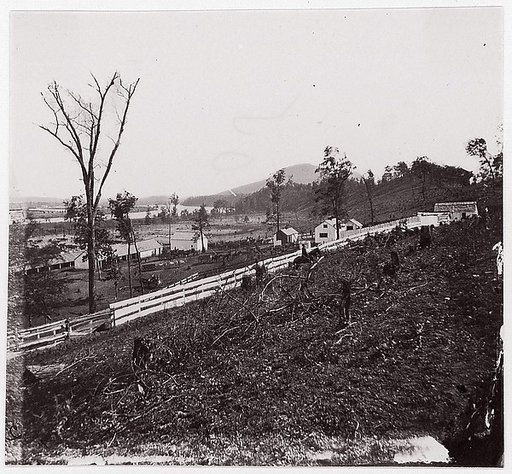 [White picket fence with buildings in background].  Brady album, p. 123