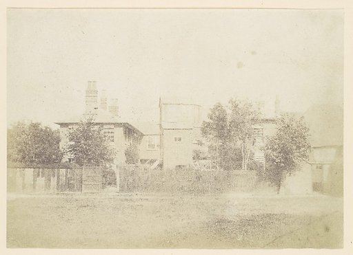 [Compound of Buildings Surrounded By Fence]
