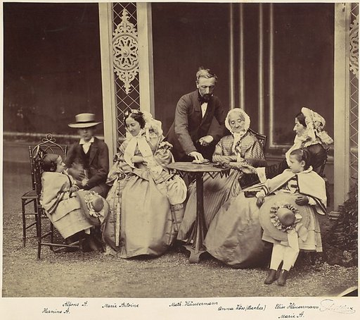 [Group Portrait of Five Adults and Two Children in a Garden]