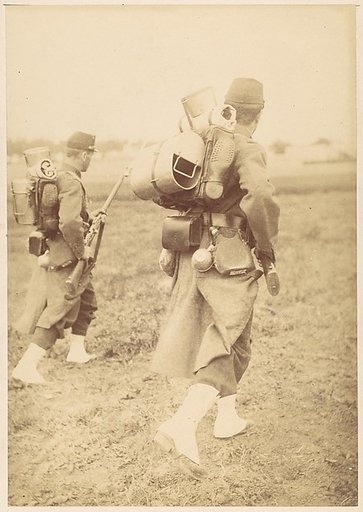 [Two Soldiers Packing Gear]