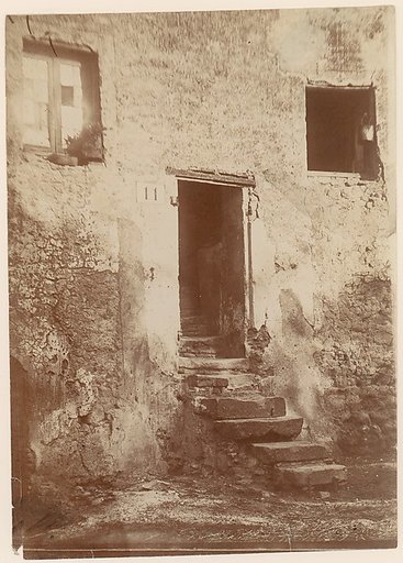 [Doorway Into Crumbling Brick Building]