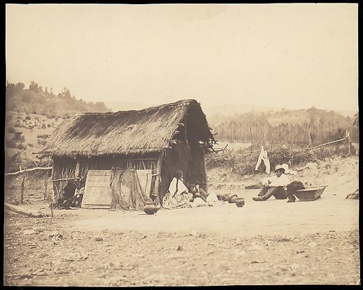 [Family Seated by Thatched Hut, South America]