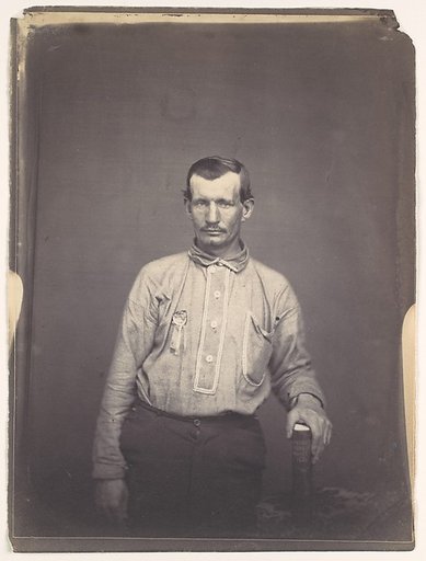 [Man Holding Patent Office Book]