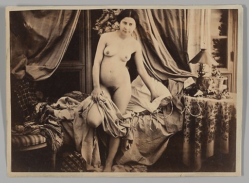 [Nude Standing by Bed]
