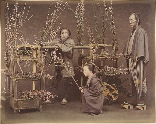 [Two Japanese Men and One Japanese Woman Posing with Flowering Branches]