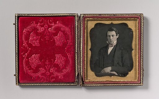 [Young Man with Up-turned Collar and Bow Tie]