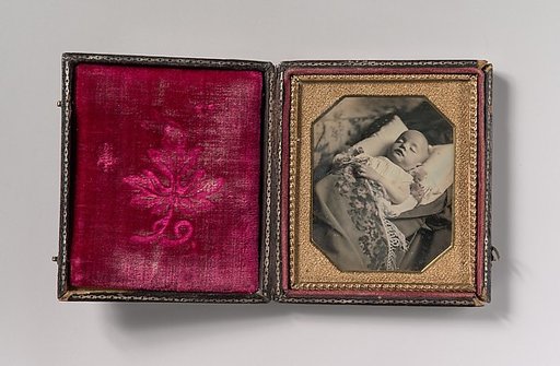 [Postmortem Baby, Partially Covered by a Flowered Shawl with a Fringe Hem]