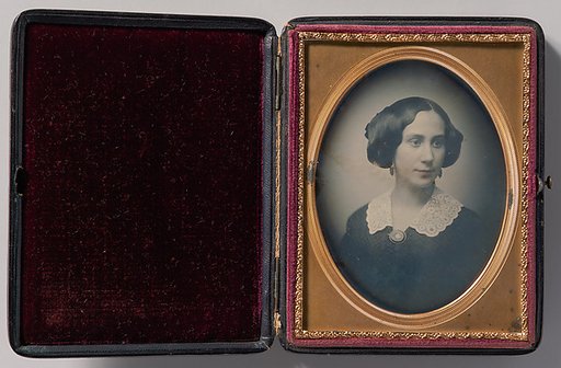 [Young Woman Wearing Lace Collar and Brooch]