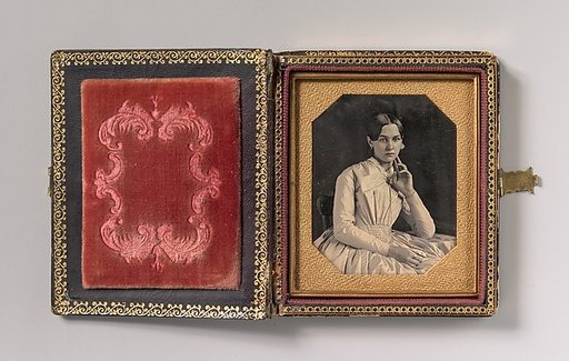 [Seated Young Woman with Hand Raised to Jawline]