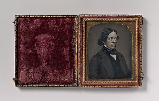 [Elderly Man with Dark Hair]