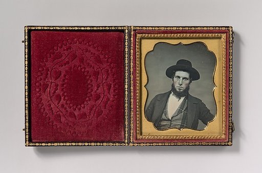 [Bewhiskered Man in Hat and Plaid Vest]