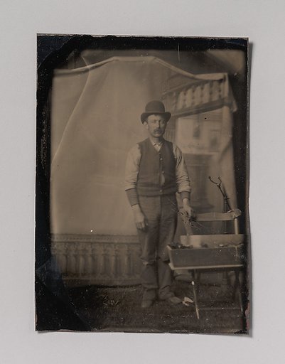 [Workman with Tool Box]