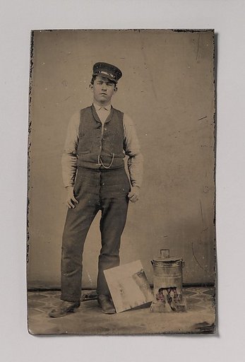 [Tinsmith with Coal Heater and Sheet of Tin]