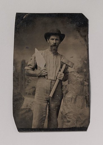 [Mason (?) Holding a Trowel and Sledgehammer]