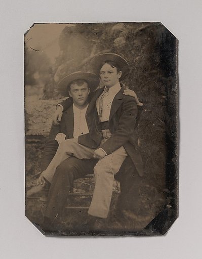 [Two Young Men in Straw Hats, One Seated in the Other's Lap]