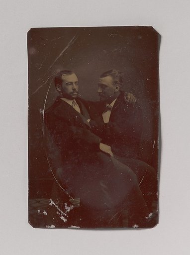 [Two Men Seated, One in the Other's Lap, with Their Hands in Suggestive Positions]