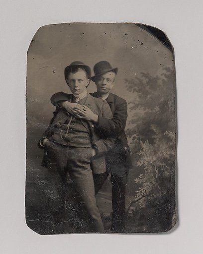 [Two Young Men, One Embracing the Other]