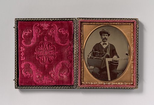 [Carpenter Holding a Bag of Tools and a Square]