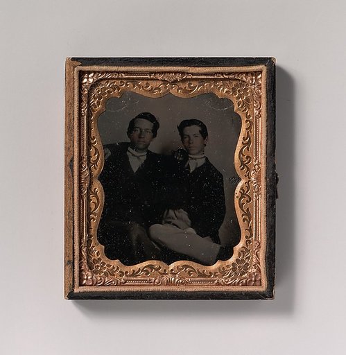 [Two Young Men Seated with Their Arms Around Each Other]