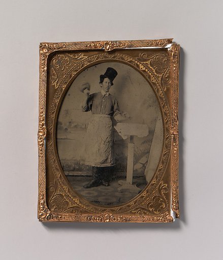 [Stone Mason in Top Hat and Apron with Mallet and Chisel]