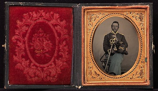 [Union Cavalry Officer Displaying Sword, Holding Hat, Seated in Studio]