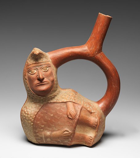 Stirrup-spout bottle with peanut figure