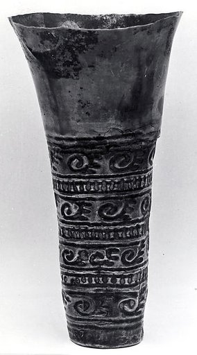 Beaker with scroll ornamentation