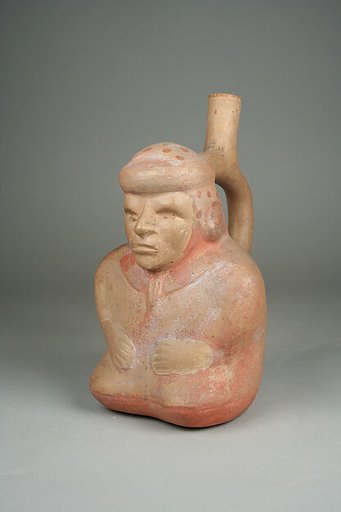Stirrup spout bottle with sitting blind man