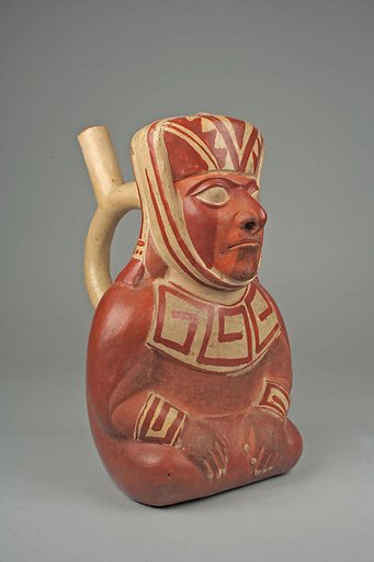 Stirrup spout bottle with dignitary figure