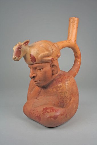 Stirrup spout bottle with figure with llama headdress