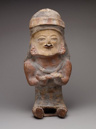 Figure Holding Child