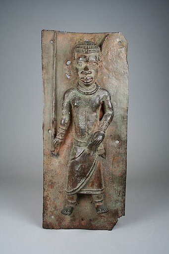Plaque with court official with magical staff